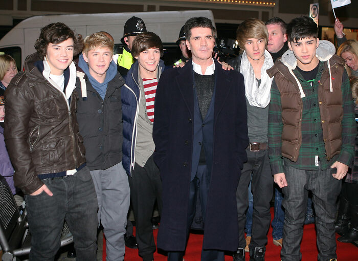 Simon Cowell with young male singers on red carpet amid media, addressing rumors about Liam Payne's mental health struggles. Simon Cowell with young male singers on red carpet amid media, addressing rumors about Liam Payne's mental health struggles.