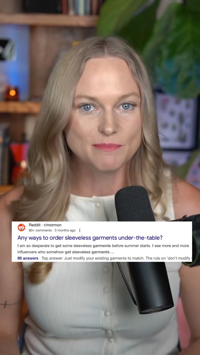 Woman speaking into microphone in a home studio, discussing Mormon women and more revealing versions of sacred underwear.