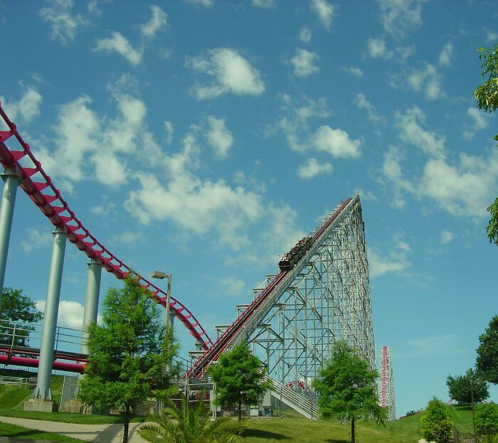 Roller coaster with a 205-foot drop capturing a couple saving a terrified girl after her seat belt pops open.