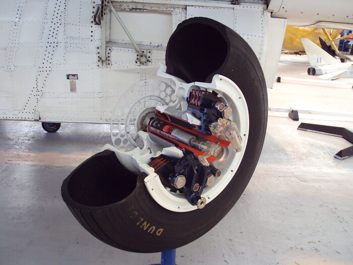 Cutaway view of an aircraft wheel showing the detailed insides of the object and its mechanical components.