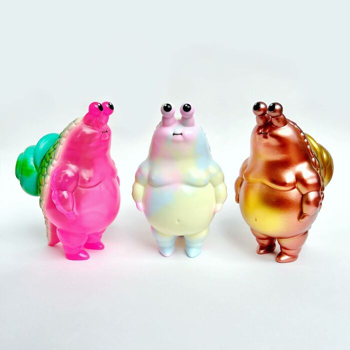 Three quirky sculptures with colorful, bubbly designs and exaggerated features showcasing artistic personality and creative expression.