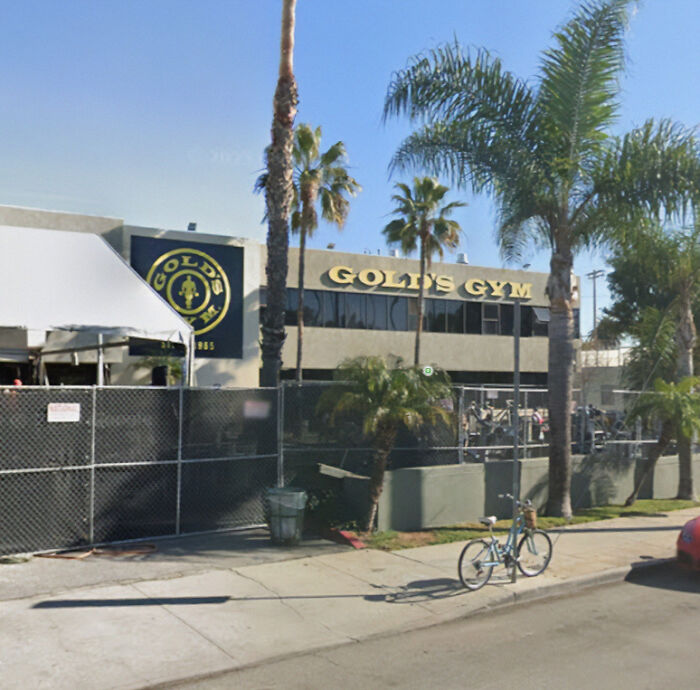 Gold's Gym exterior with palm trees, related to uproar over lesbian removed after confronting alleged trans woman. Gold's Gym exterior with palm trees, related to uproar over lesbian removed after confronting alleged trans woman.