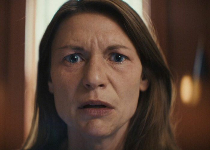 Claire Danes with a quivering chin, close-up showing emotional expression in her new hit show scene. Claire Danes with a quivering chin, close-up showing emotional expression in her new hit show scene.