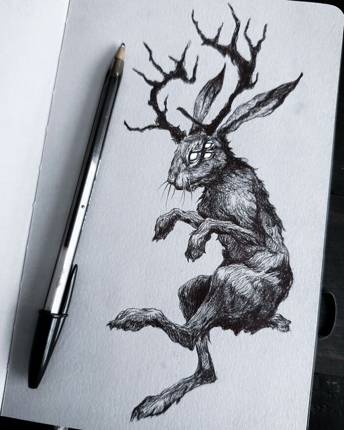 Sketch of a creepy yet gorgeous nightmare-inspired creature with antlers and multiple eyes drawn in black pen.