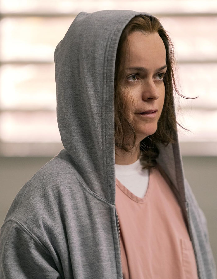 Taryn Manning wearing a gray hoodie and pink top, fans worried after bizarre video comparing her to Britney Spears.