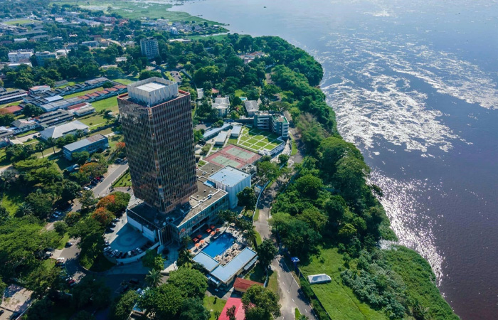 Aerial view of a city by a river, illustrating the poorest country in the world facing economic and environmental hardship.