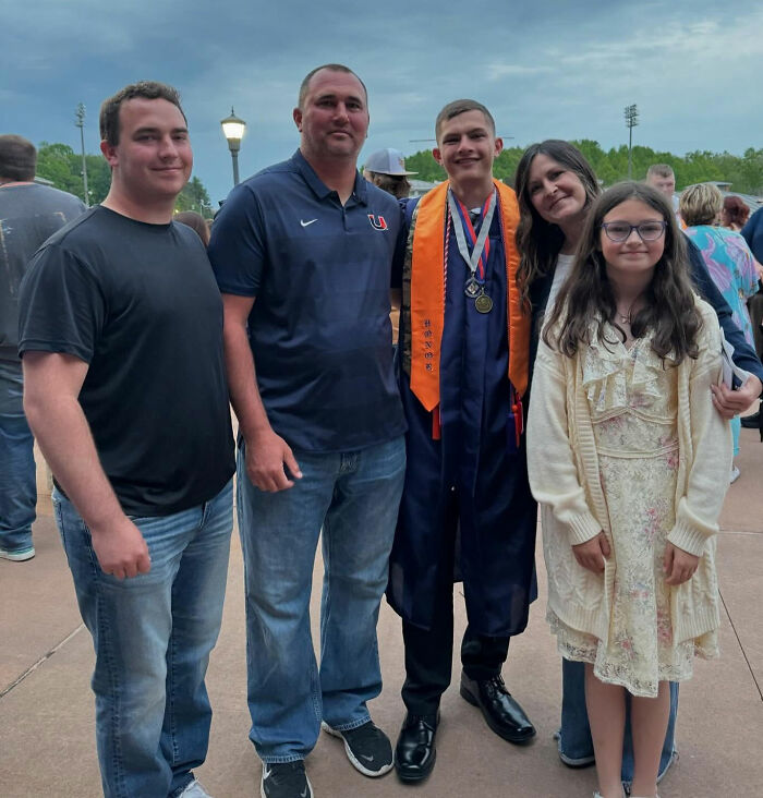 Group of five people posing outdoors at a graduation event with a focus on the missing football coach case mystery. Group of five people posing outdoors at a graduation event with a focus on the missing football coach case mystery.