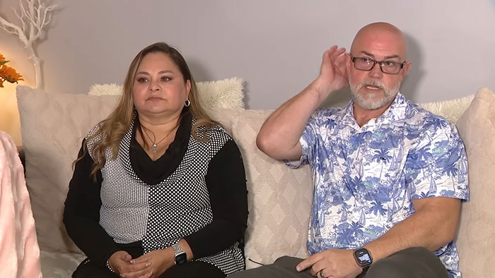 Couple sitting on a couch discussing the woman born without most of her brain as family speaks out on her 20th birthday. Couple sitting on a couch discussing the woman born without most of her brain as family speaks out on her 20th birthday.