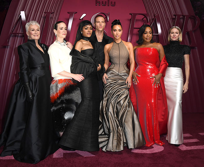 Cast members at the All's Fair premiere with Kim Kardashian posing on the red carpet in elegant gowns and suits. Cast members at the All's Fair premiere with Kim Kardashian posing on the red carpet in elegant gowns and suits.