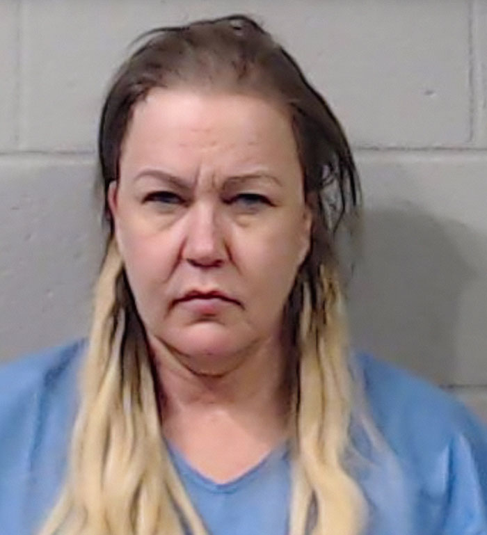 Mugshot of a woman with blonde hair wearing a blue shirt related to former news anchor case involving her mother. Mugshot of a woman with blonde hair wearing a blue shirt related to former news anchor case involving her mother.