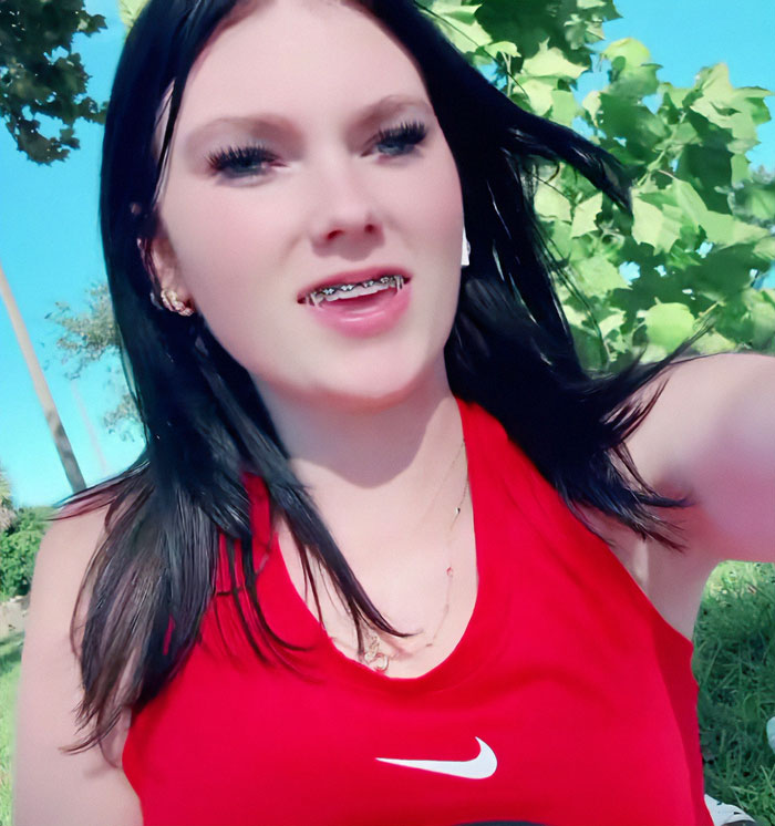Teen in red shirt with braces outdoors, related to stepbrother obsession case in a cruise incident, according to ex reveals. Teen in red shirt with braces outdoors, related to stepbrother obsession case in a cruise incident, according to ex reveals.
