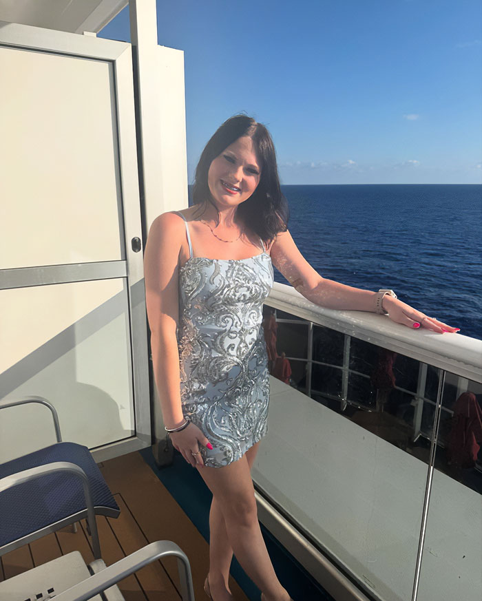 Teen girl in patterned dress standing on cruise ship balcony overlooking the ocean, related to babysitter affair news. Teen girl in patterned dress standing on cruise ship balcony overlooking the ocean, related to babysitter affair news.