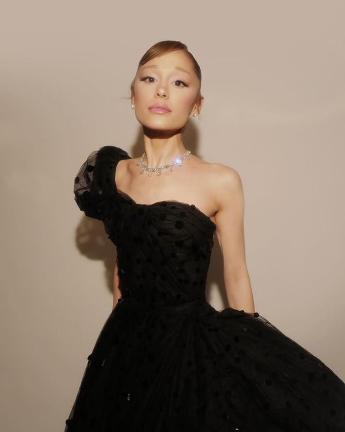 Ariana Grande in a black one-shoulder dress, fans concerned Wicked role is affecting her energy after latest appearance.