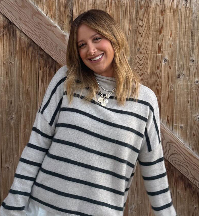 Ashley Tisdale smiling in a striped sweater, sharing details about her official name change and reasons behind it. Ashley Tisdale smiling in a striped sweater, sharing details about her official name change and reasons behind it.