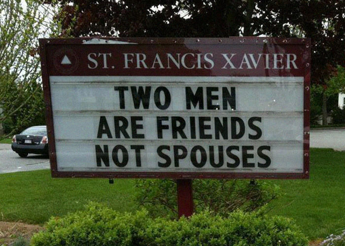 Sign outside St. Francis Xavier church with a message highlighting unusual family dramas and relationships.