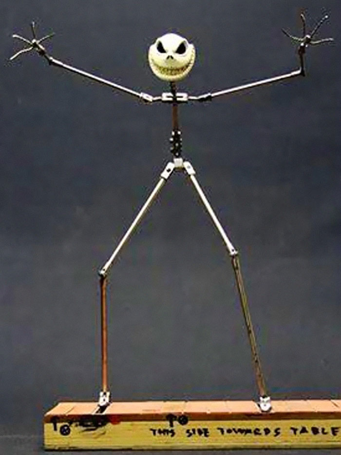 Skeleton armature model with an expressive face, a behind-the-scenes photo capturing unhinged meme potential.