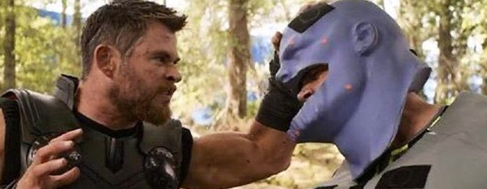 Thor and Korg in an unhinged behind-the-scenes photo showing a playful moment during filming.