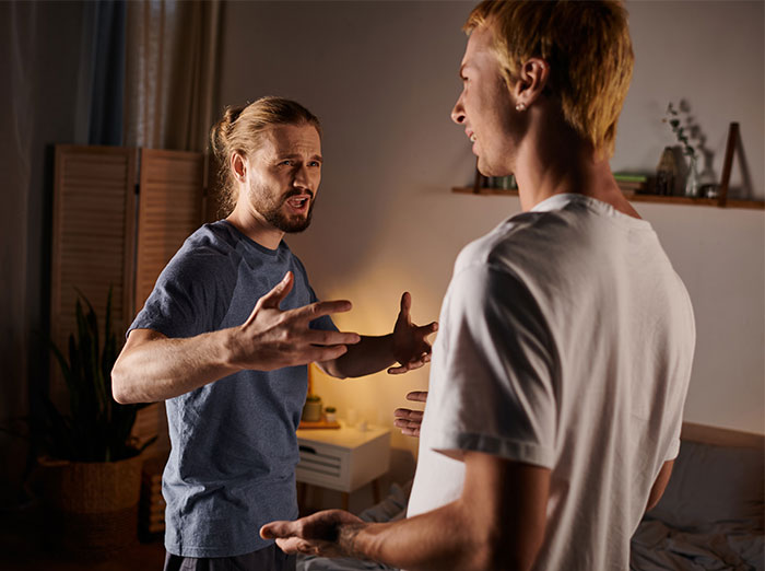 Two men in a heated argument indoors as bride’s family considers calling off the wedding over legal threats. Two men in a heated argument indoors as bride’s family considers calling off the wedding over legal threats.