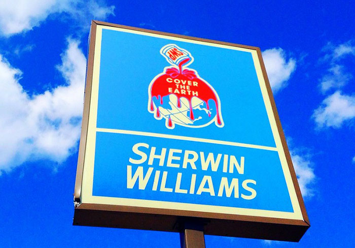Sherwin Williams sign against blue sky representing businesses that lost clients with poor decisions.
