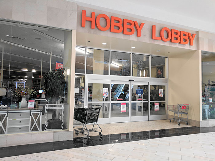 Hobby Lobby storefront in a shopping mall with empty shopping carts symbolizing businesses that lost clients poor decisions