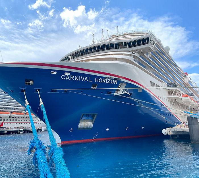 Cruise ship docked at port with clear sky, related to stepbrother of teen slain in cruise incident and obsession details. Cruise ship docked at port with clear sky, related to stepbrother of teen slain in cruise incident and obsession details.
