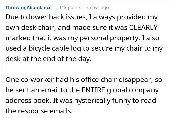 Person securing his $1.8K office chair with a bicycle lock to prevent theft at work, highlighting office chair concerns.