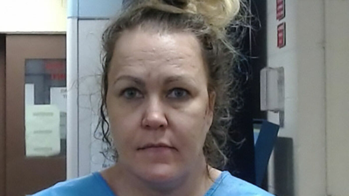 Former news anchor in a blue shirt with messy hair in an indoor setting highlighting the news anchor keyword.