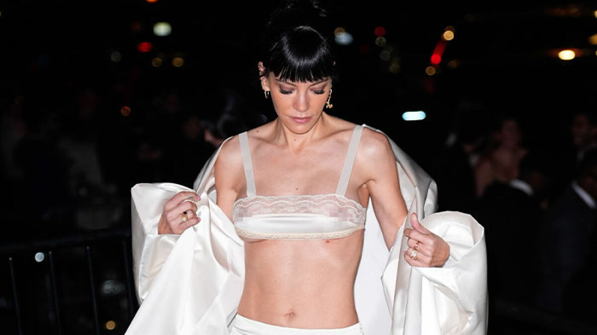 Lily Allen at CFDA Fashion event wearing a revealing white outfit sparking online fashion debate and discussions.