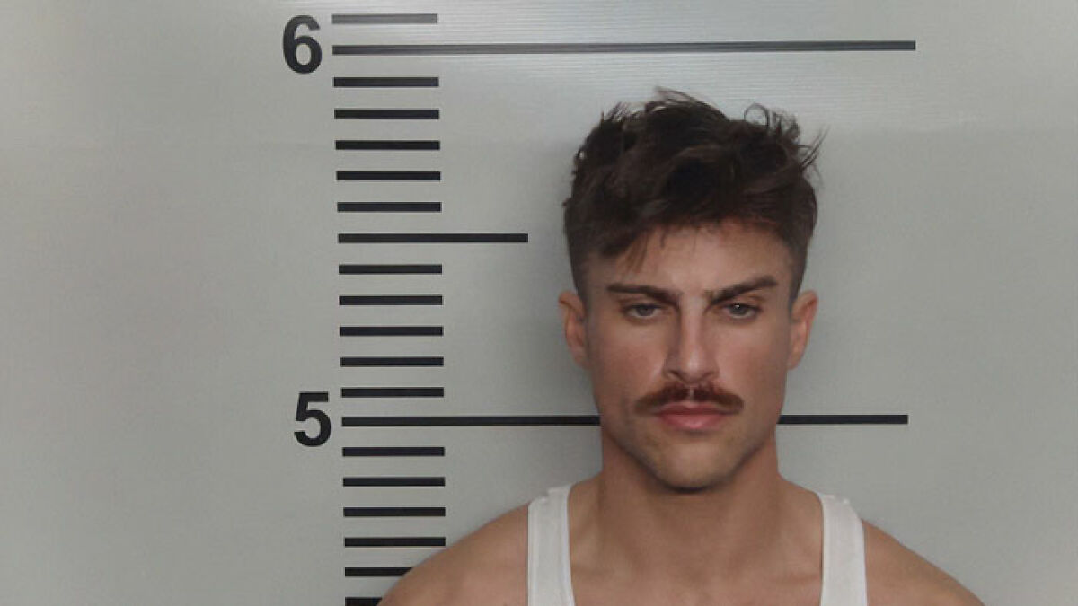Manu2019s hot mugshot with mustache and tousled hair turning him into a viral sensation resembling the next Brad Pitt.