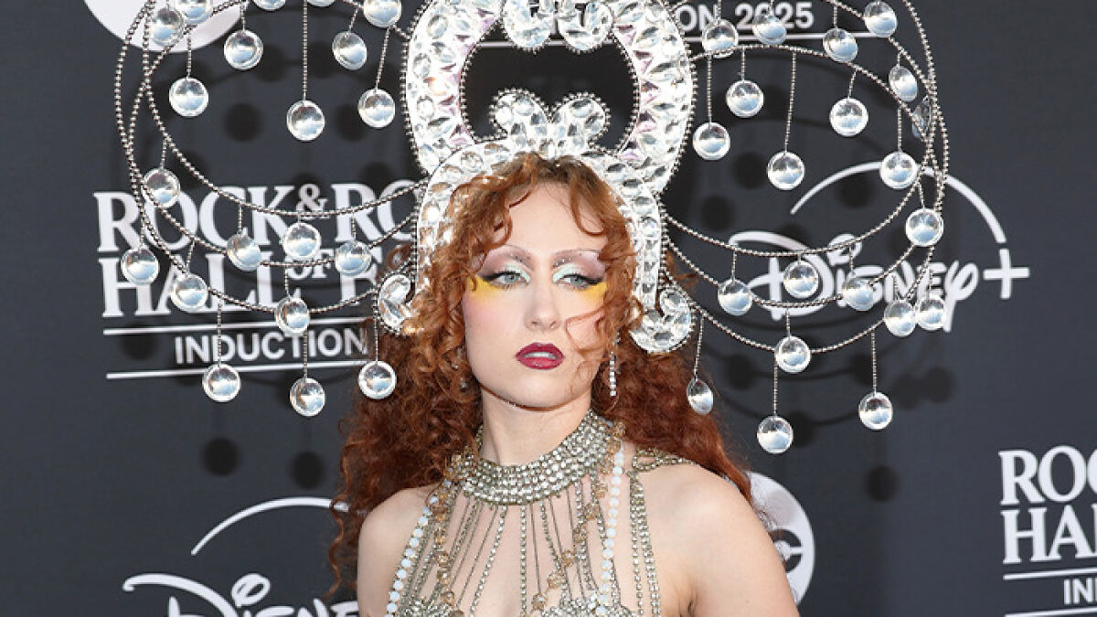 Chappell Roan at Rock Hall of Fame 2025 wearing an elaborate crystal headpiece and detailed statement necklace.