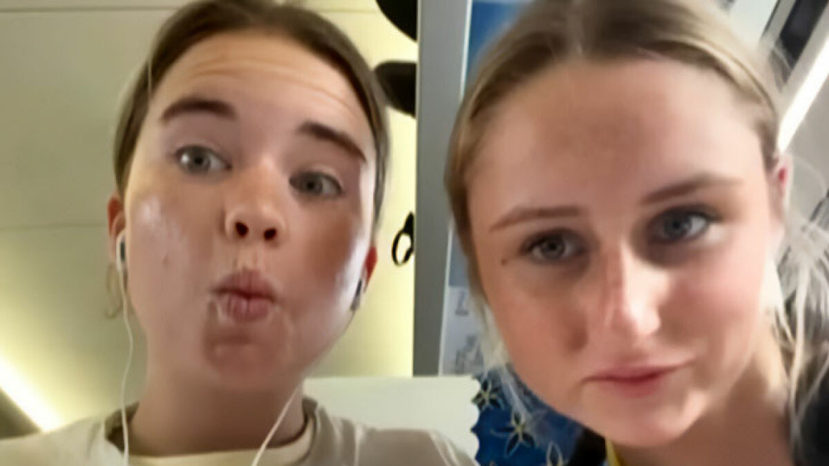 Two young women posing for a selfie, related to parents warning against travel after daughters lose their lives on vacation