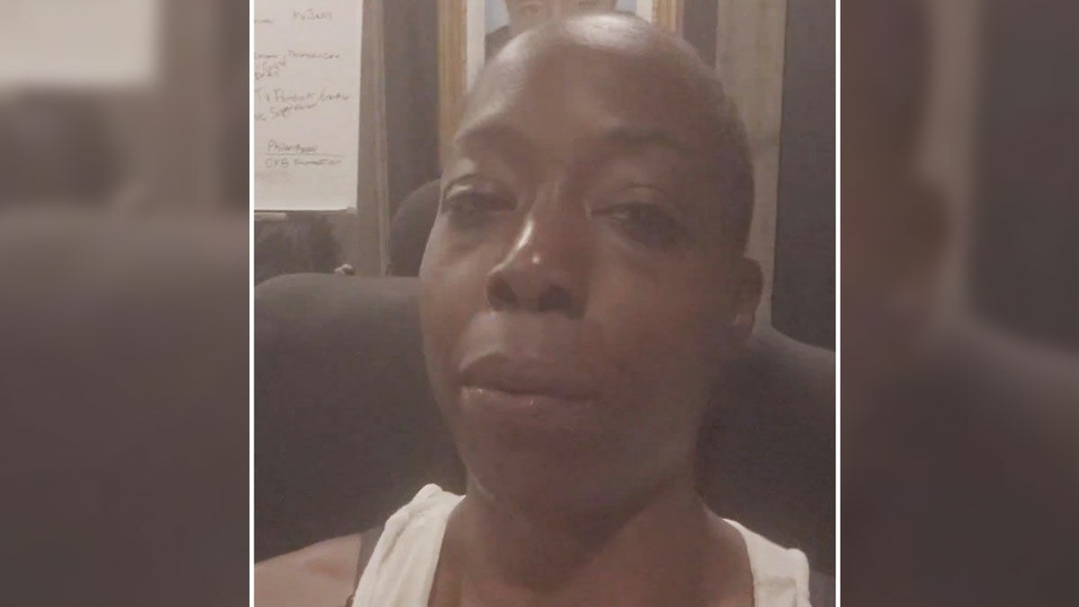 Close-up of a person sitting indoors during a video, related to lesbian banned from Gold's Gym controversy.