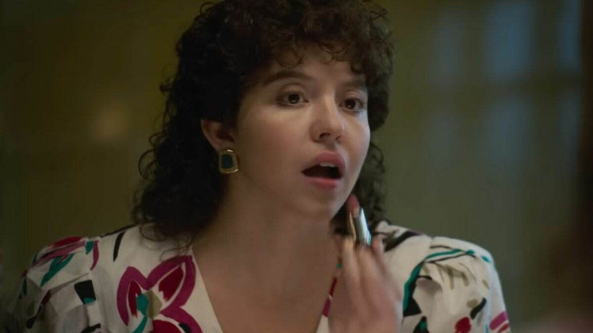 Actress applying lipstick in a scene related to leaked PR emails about Sydney Sweeney damage control after Christy flops.