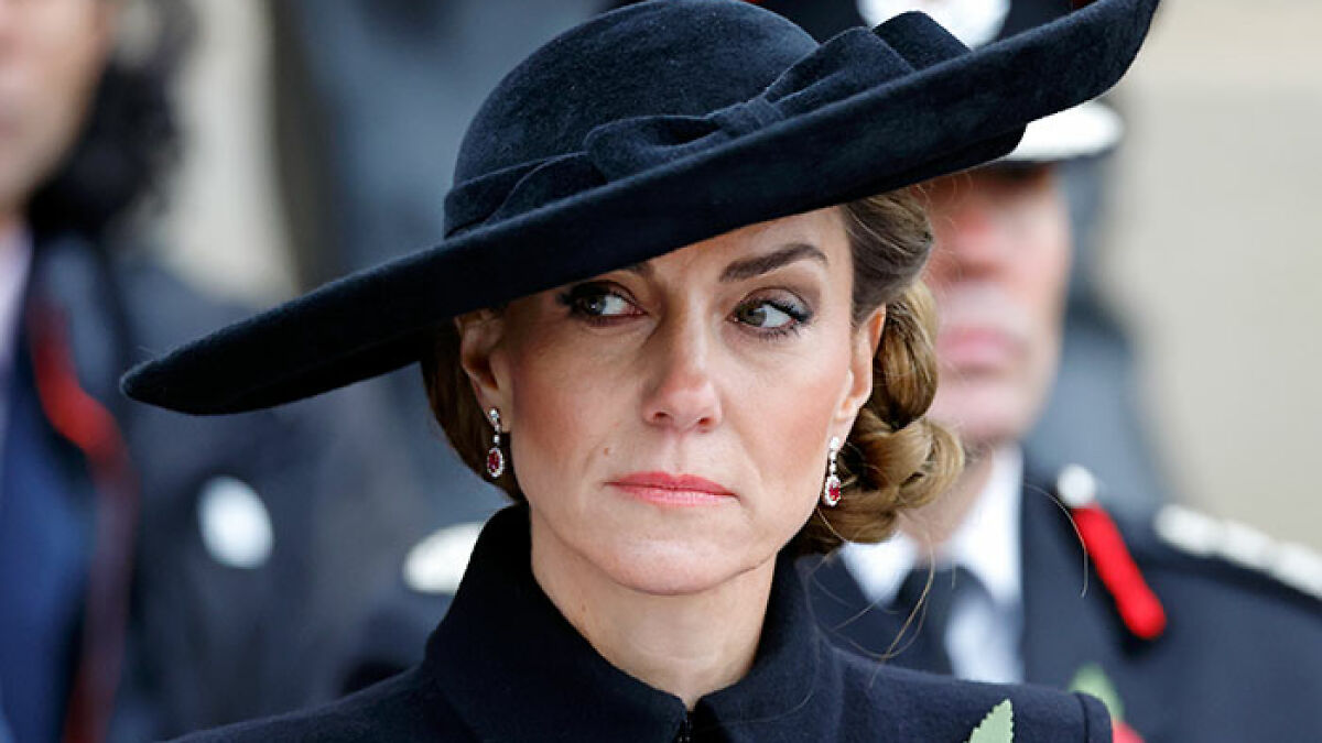 Princess Kate looking serious in a black hat and coat during a public event amid BBC headline backlash.