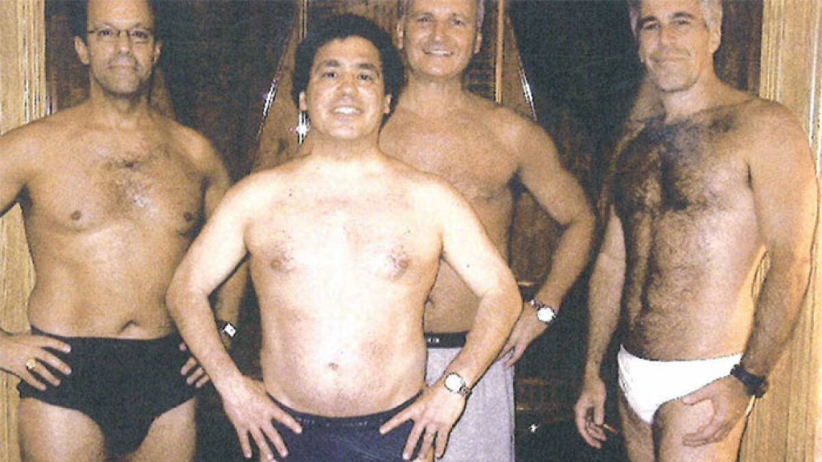 Four shirtless men standing confidently indoors, one wearing black briefs and others in swimwear, highlighting Epstein manhood discussion.