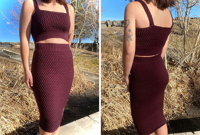 Woman models a handmade crochet two-piece outfit with textured pattern, showcasing proud crochet enthusiasts' project outdoors.