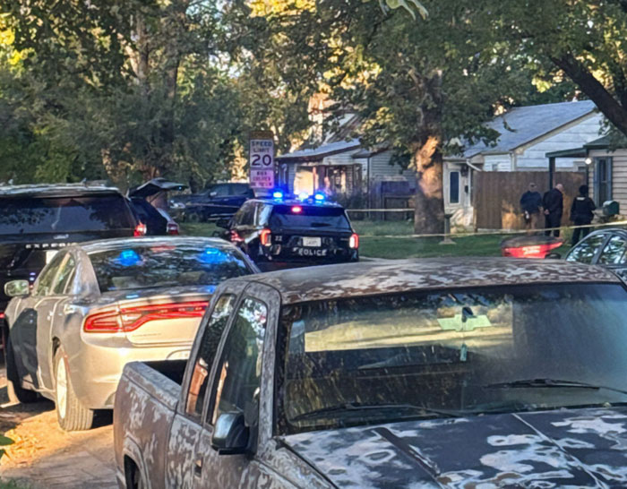 Police car with flashing lights at a residential scene where a former news anchor is involved in a Halloween incident. Police car with flashing lights at a residential scene where a former news anchor is involved in a Halloween incident.