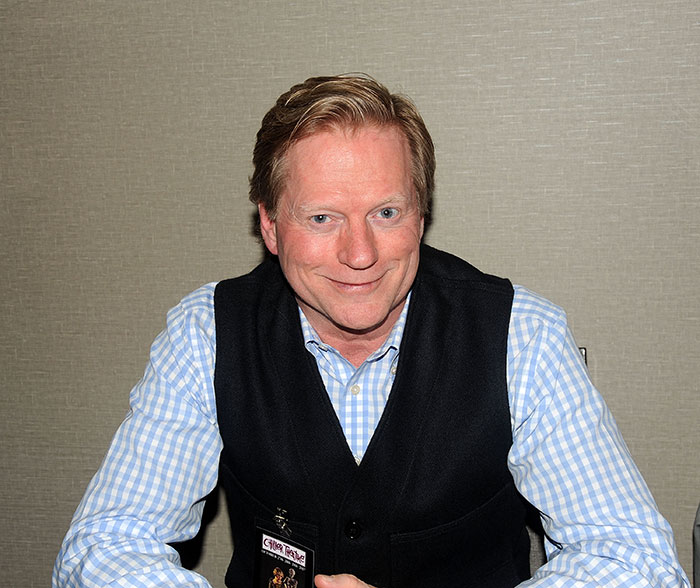 Man in a checkered shirt and black vest at an event, related to Melissa Gilbert feeling nauseated about age gap. Man in a checkered shirt and black vest at an event, related to Melissa Gilbert feeling nauseated about age gap.