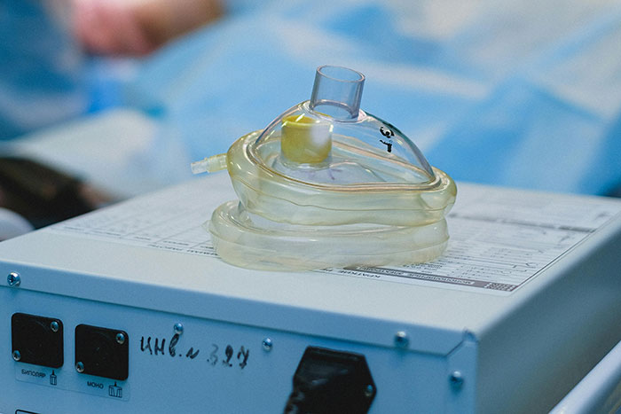 Medical oxygen mask placed on hospital equipment, highlighting moments when doctors messed up bad in healthcare settings.