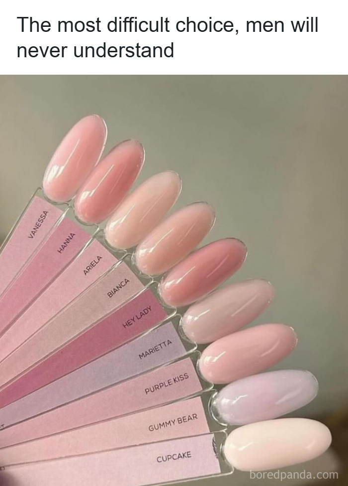 Various shades of pink nail polish samples displayed on a fan palette, illustrating makeup and fashion choices.