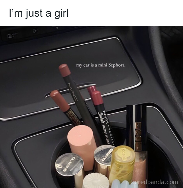 Makeup products stored in a car cup holder, highlighting makeup, fashion, and diva life humor.