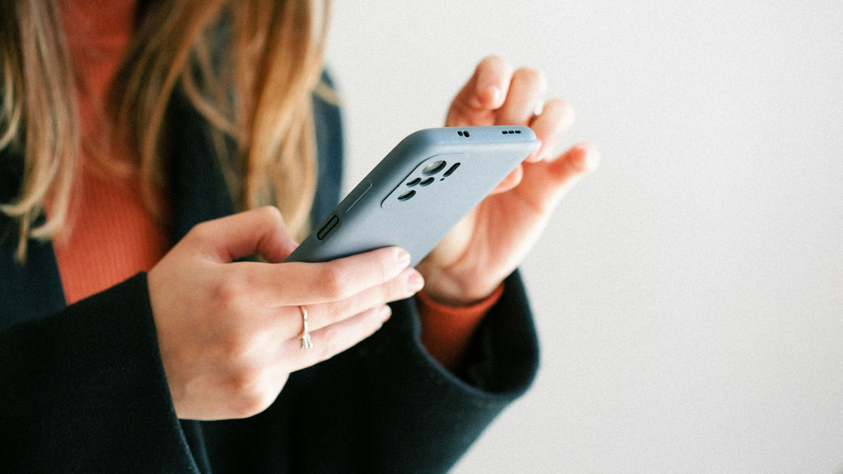 Person holding smartphone texting, illustrating client texts with entitled messages being shared online.