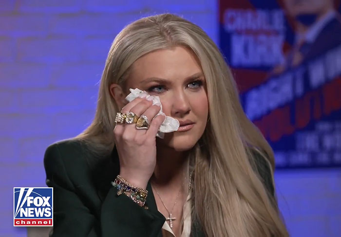 Erika Kirk wiping tears during an emotional interview addressing the viral inappropriate hug with JD Vance.