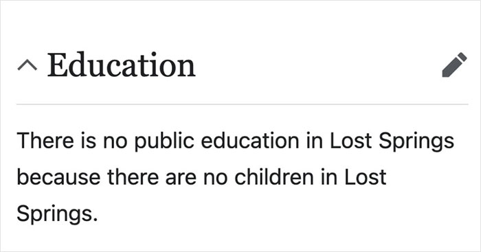 Screenshot of a Wikipedia entry humorously stating no public education in Lost Springs due to no children, a funny Wikipedia gem.