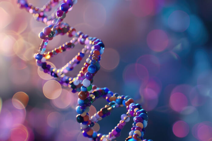 Colorful DNA double helix model with glowing bokeh background representing online thread sharing upcoming events.