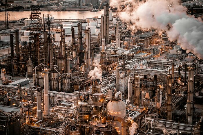 Industrial complex emitting smoke, representing positive stereotypes about various countries' manufacturing and industry.