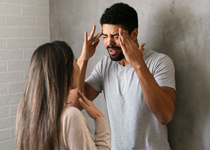 Young couple in a tense argument indoors, highlighting conflict after mom interferes in daughter’s happy relationship.