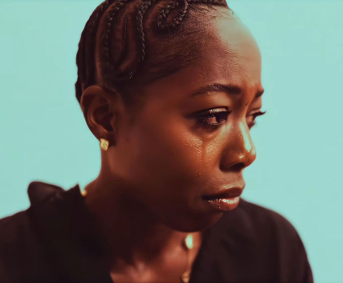 Close-up of a tearful woman, conveying emotion related to trans woman confronted in gym locker room situation. Close-up of a tearful woman, conveying emotion related to trans woman confronted in gym locker room situation.