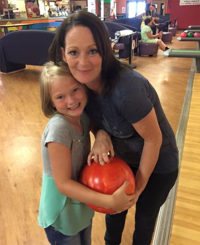 Mother and daughter smiling together at bowling alley, related to stepbrother obsessed with teen slain on cruise story. Mother and daughter smiling together at bowling alley, related to stepbrother obsessed with teen slain on cruise story.