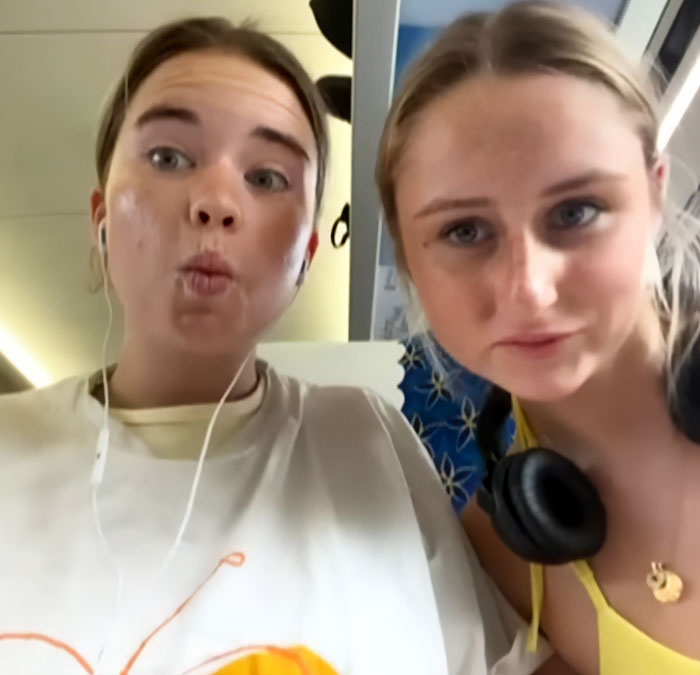 Two young women posing for a selfie, related to parents warning against travel after daughters lose their lives on vacation. Two young women posing for a selfie, related to parents warning against travel after daughters lose their lives on vacation.